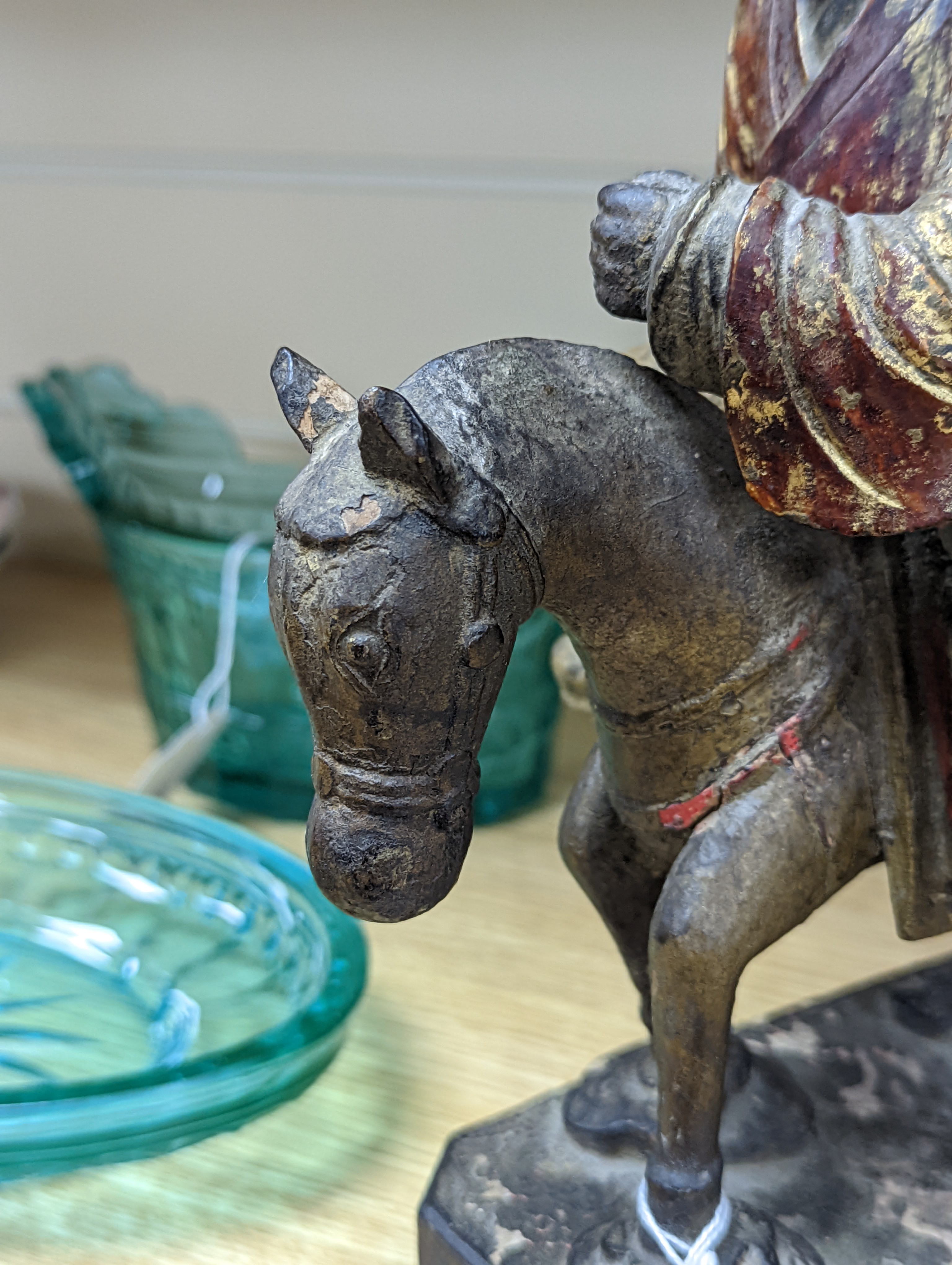An 18th/19th century Chinese lacquered wood group of an official riding a horse, 30cm